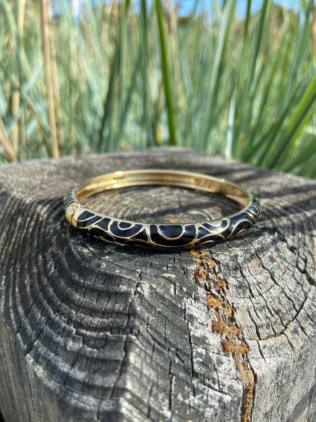 Gold Tone Black Enamel Spring Hinge Bangle